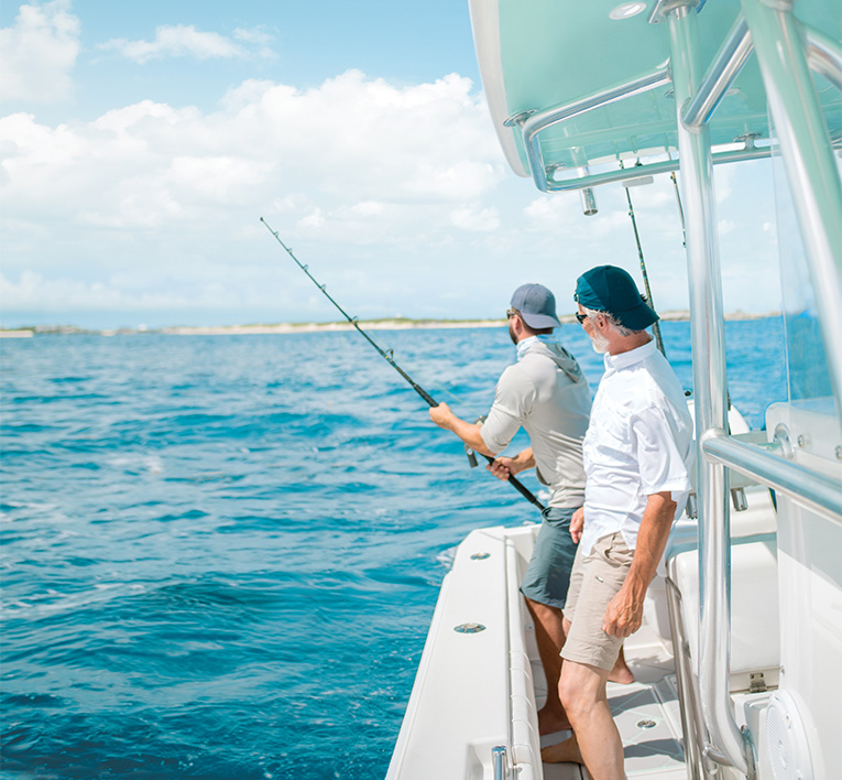 two men fishing on a boat
