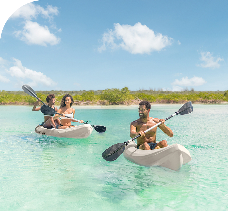 a group of people in kayaks in the water