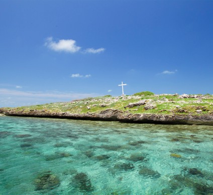 a cross on a small island