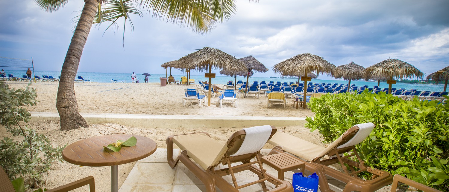 chairs and tables on a beach