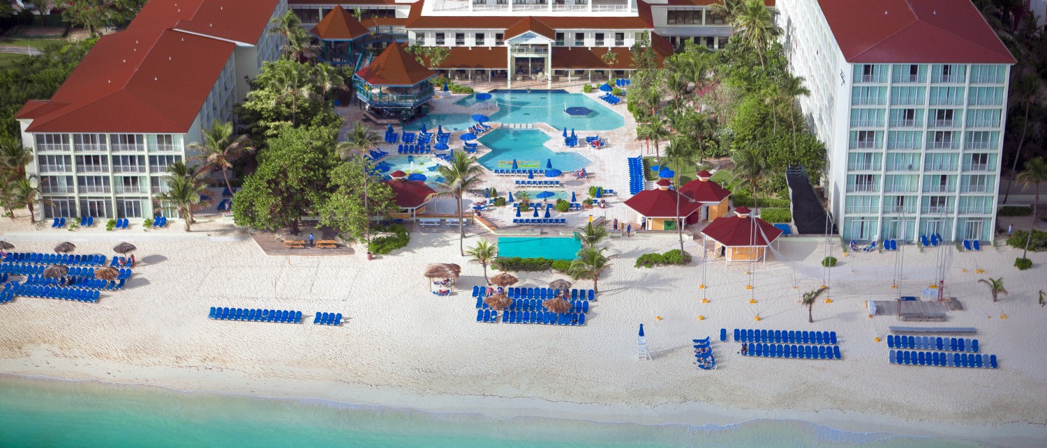 a resort with a pool and a beach