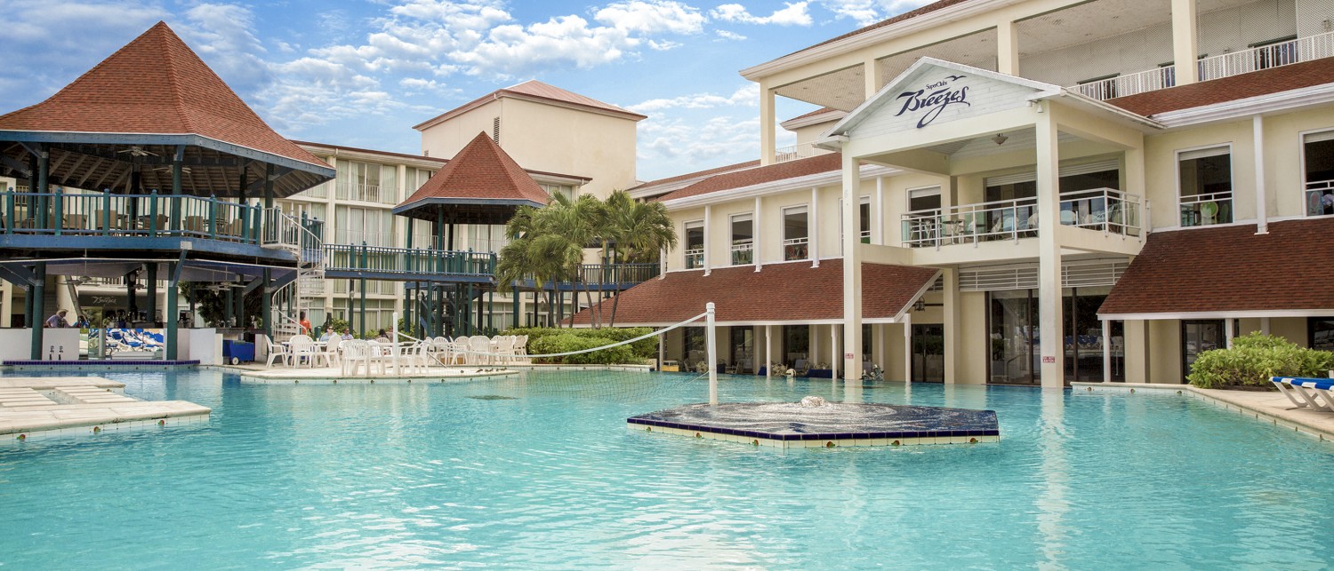 a pool with a building and a pool