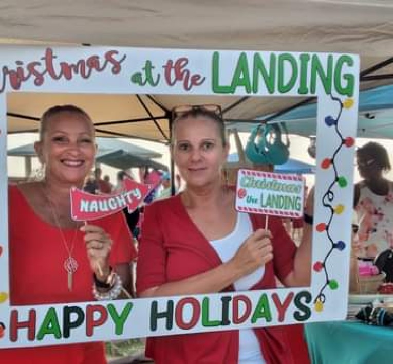 a couple of women holding signs
