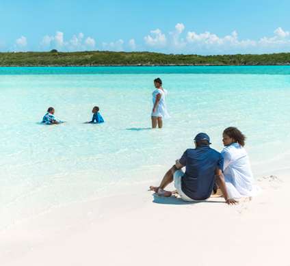 DPM and family on beach  424x389px