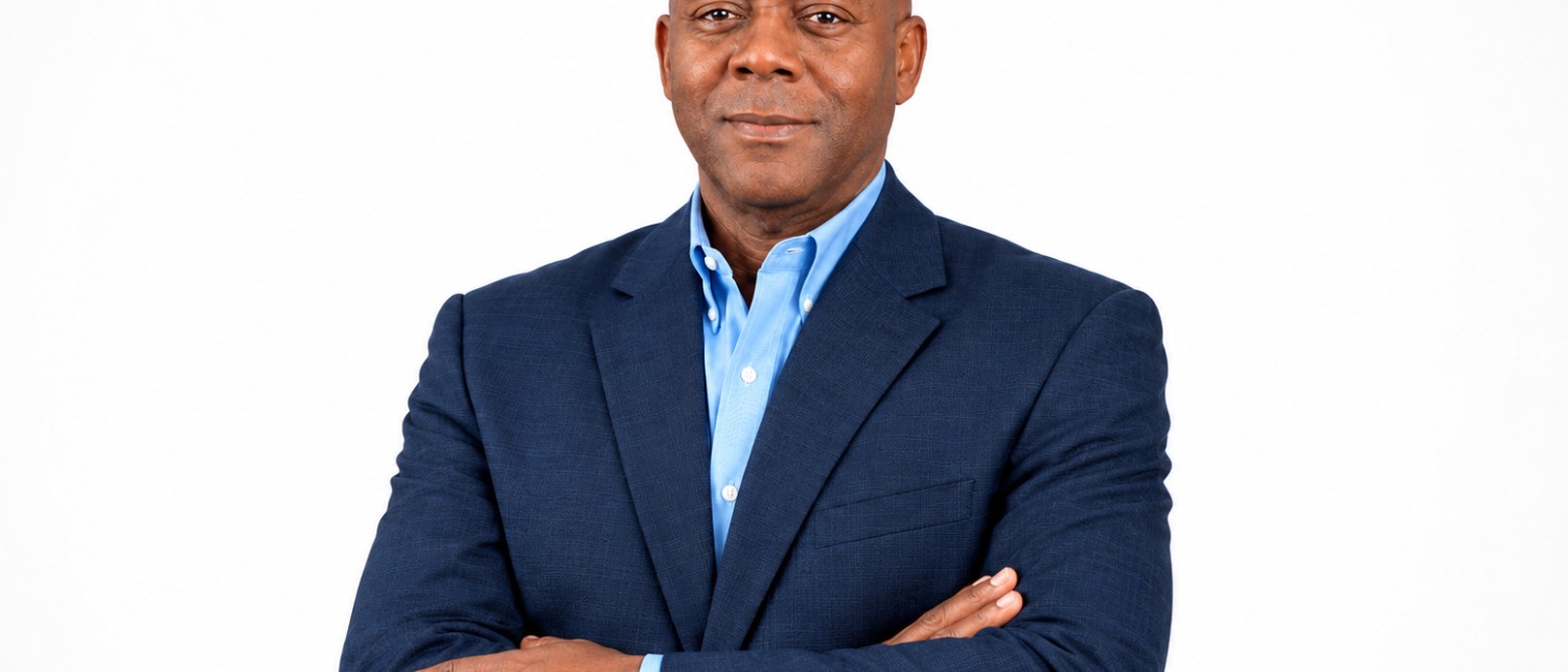 a man in a suit with his arms crossed