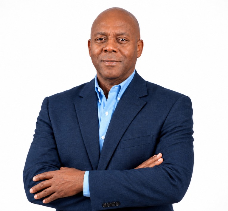 a man in a suit with his arms crossed