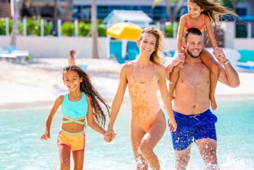 a group of people walking in water