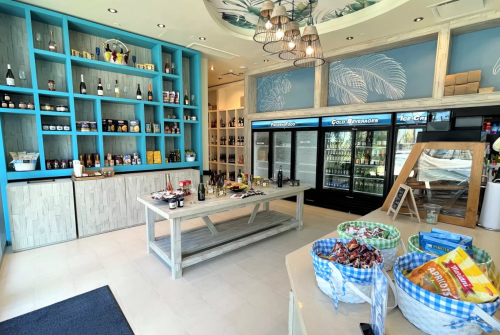 a room with shelves of food and drinks