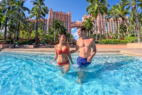 a man and woman in a pool