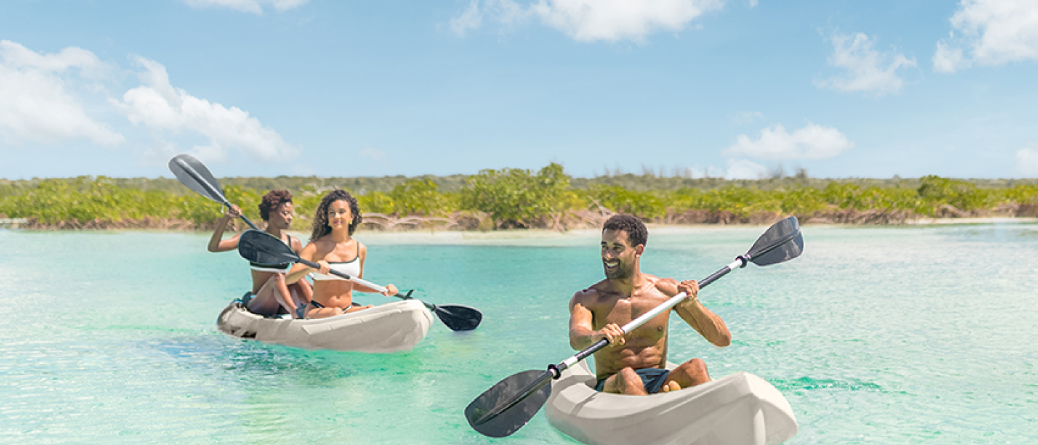 a group of people in kayaks in the water