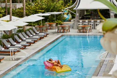 a woman on a float in a pool