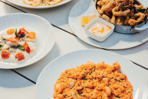 a group of plates of food on a table