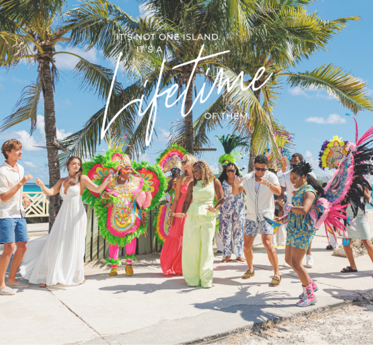 a group of people in clothing on a beach