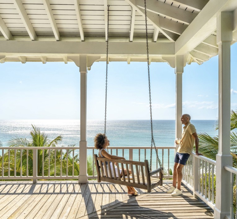 a man and woman on a porch swing