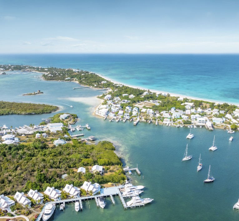 a aerial view of a small town with boats in the water