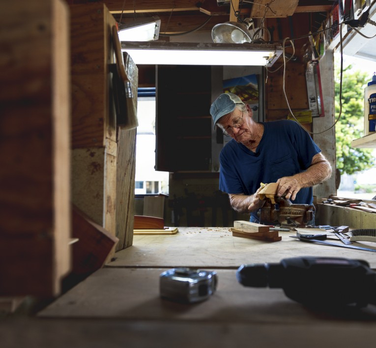 a man working on a piece of wood