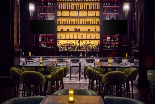 a bar with many bottles of alcohol