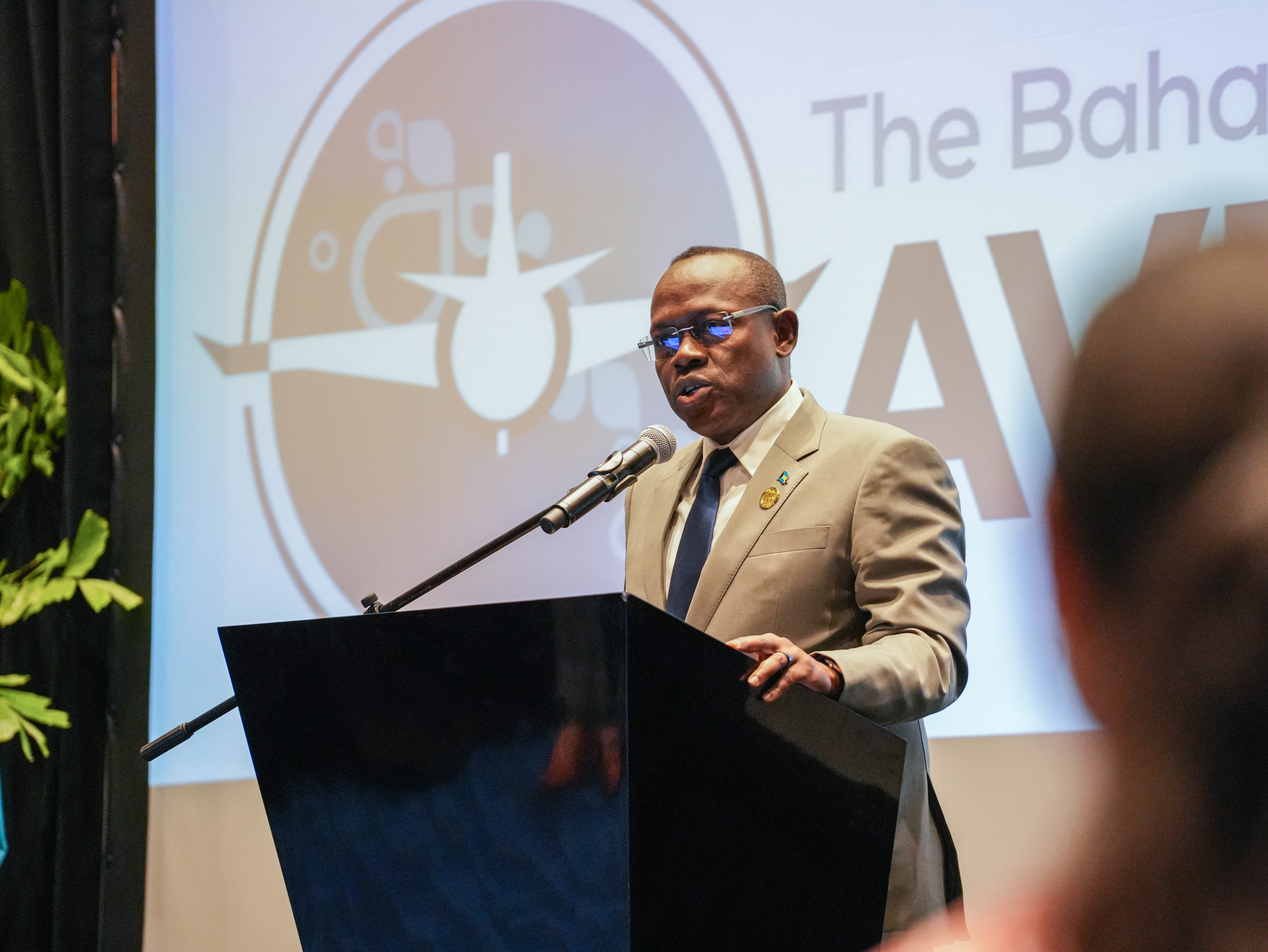 a man speaking at a podium