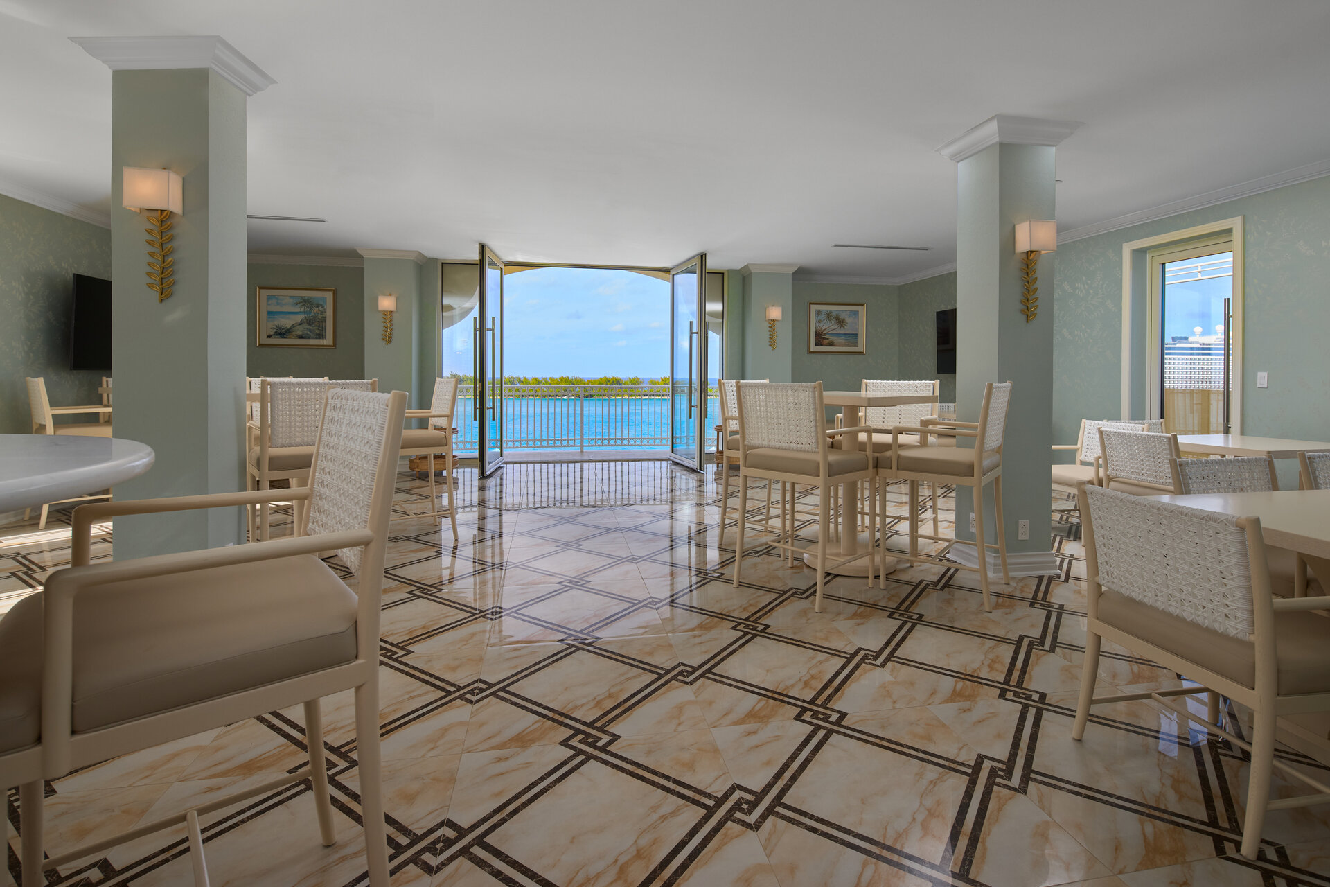 a room with chairs and a large open door