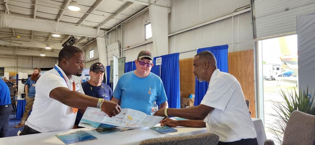 a group of men looking at a paper