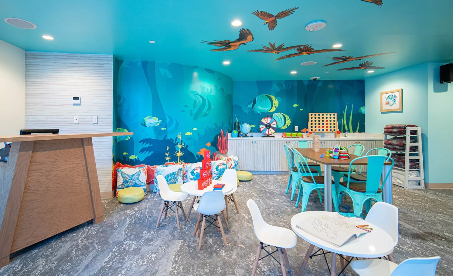 a room with a blue ceiling and a table and chairs