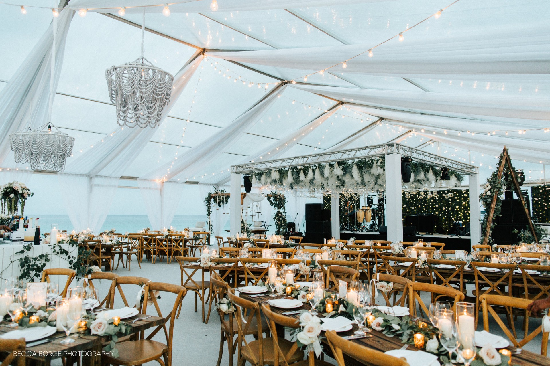 a tent with tables and chairs